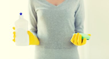 close up of woman with sponge and cleanser clipart