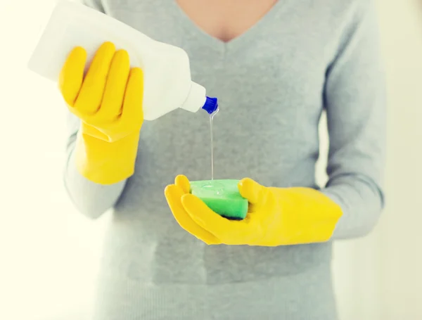 Close up of woman with sponge and cleanser — Stock Photo, Image