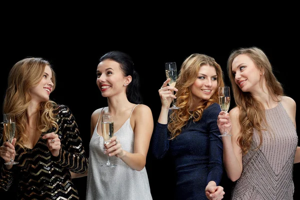 Happy women with champagne dancing over black — Stock Photo, Image