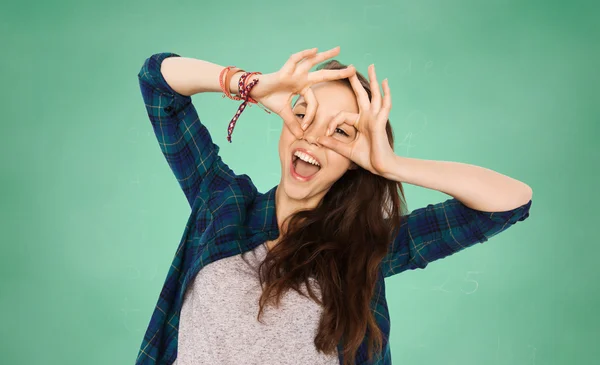 Happy teenage student girl having fun over green — Stock Photo, Image