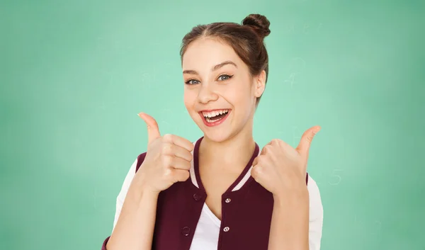 Felice adolescente studente ragazza mostrando pollici in su — Foto Stock