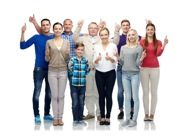 Gruppo di persone sorridenti mostrando pollici in su — Foto Stock