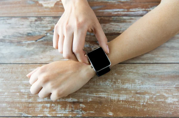 Close up of hands setting smart watch — Stock Photo, Image