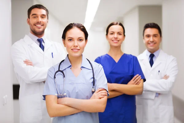 Happy group of medics or doctors at hospital Stock Photo