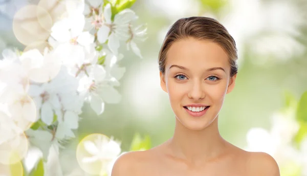 Smiling young woman face and shoulders Royalty Free Stock Images