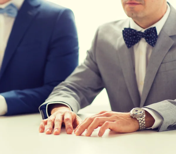 Close up of happy male gay couple hands on wedding — Stock Photo, Image