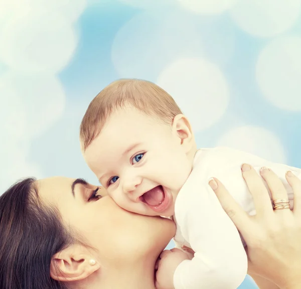 Laughing baby playing with mother — Stock Photo, Image