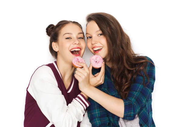 Gelukkig vrij tienermeisjes donuts eten — Stockfoto