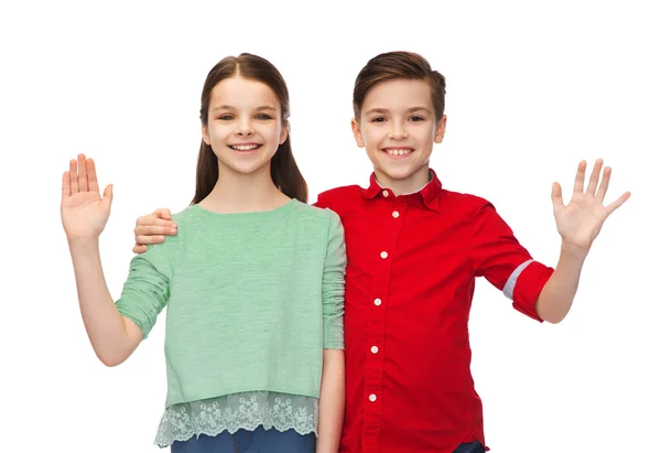 Menino feliz e menina acenando mão — Fotografia de Stock