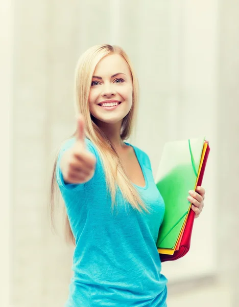 Lachende student met mappen — Stockfoto