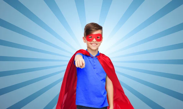 Happy boy in red superhero cape and mask — Stock Photo, Image