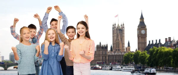 Happy children celebrating victory over london — ストック写真