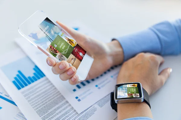 Close up of hands with smart phone and watch — Stock Photo, Image