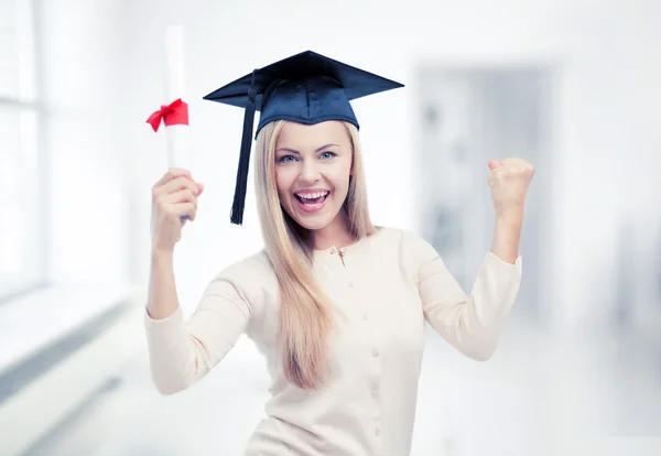 Student in graduation cap with certificate — Stock Photo, Image