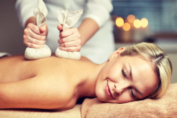 Close up of woman lying on massage table in spa — Stock Photo, Image