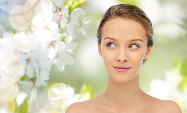 Smiling young woman face and shoulders Stock Photo