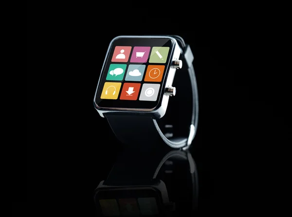 Close up of black smart watch with app icons — Stock Photo, Image