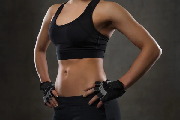 Close up of young woman body in gym — Stock Photo, Image