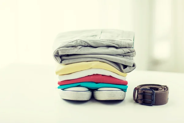 Close up of clothes and accessories on table — Stock Photo, Image