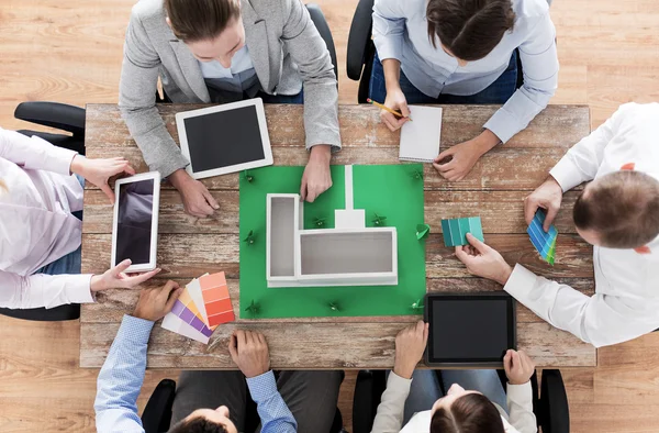 Close up of business team with project layout — Stock Photo, Image