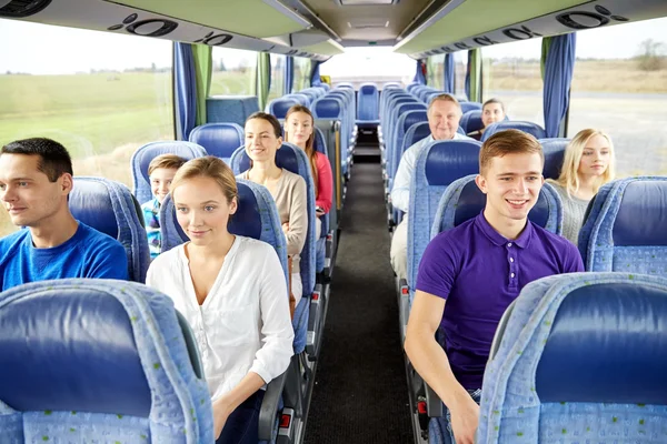 Group of happy passengers in travel bus — Stock Photo, Image