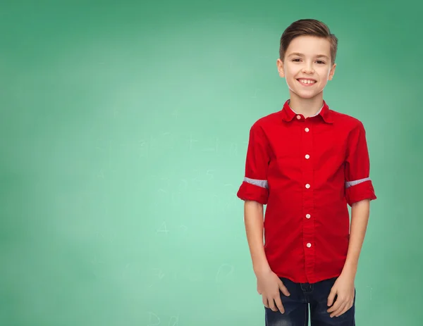 Happy boy over green school chalk board — Stock Photo, Image