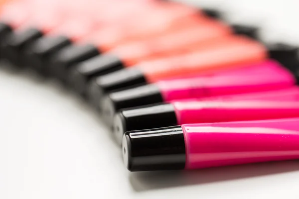 Közelkép a lip gloss csövek — Stock Fotó