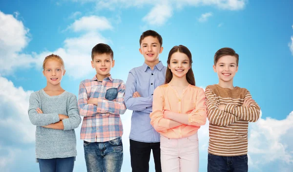 Happy smiling children over blue sky — Stok fotoğraf