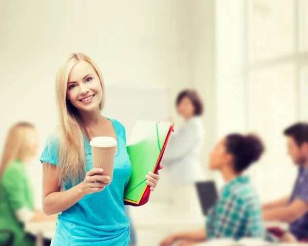 Smiling student with folders — Stock Photo, Image