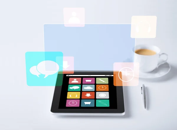 Tablet pc with application icons and cup of coffee — Stock Photo, Image