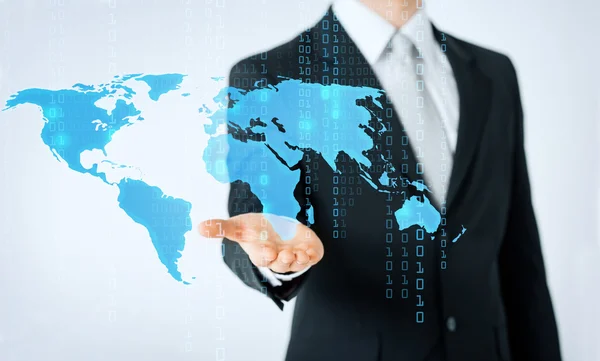 Close up of man showing world map and binary code — Stockfoto