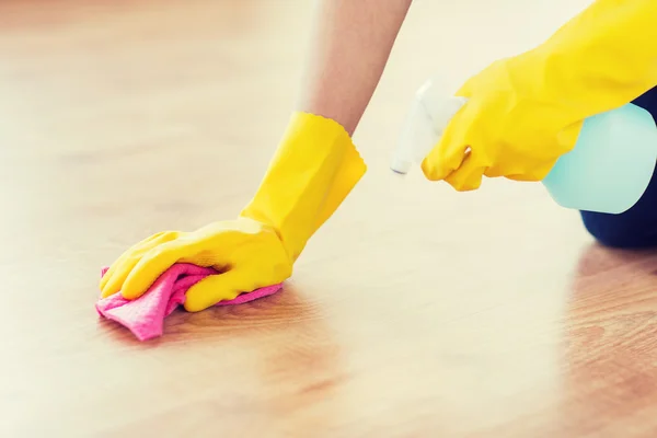 Close up of woman with rag cleaning floor at home — Stock Photo, Image