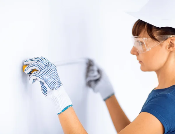 Architect measuring wall with flexible ruller — Stock Photo, Image