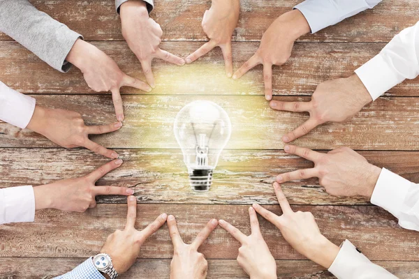 Close up of business team showing victory gesture — Stock Photo, Image