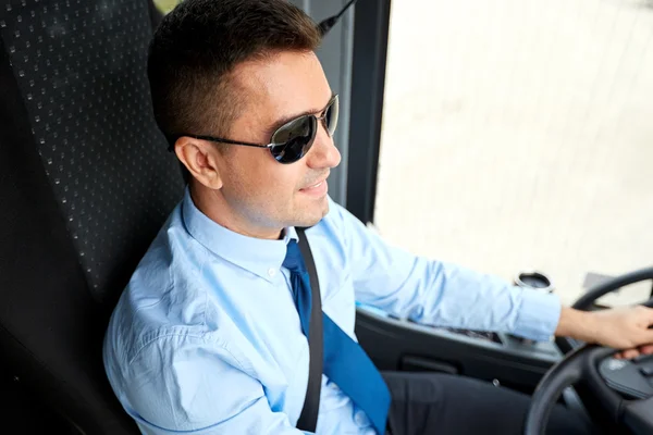 Happy driver driving intercity bus — Stock Photo, Image