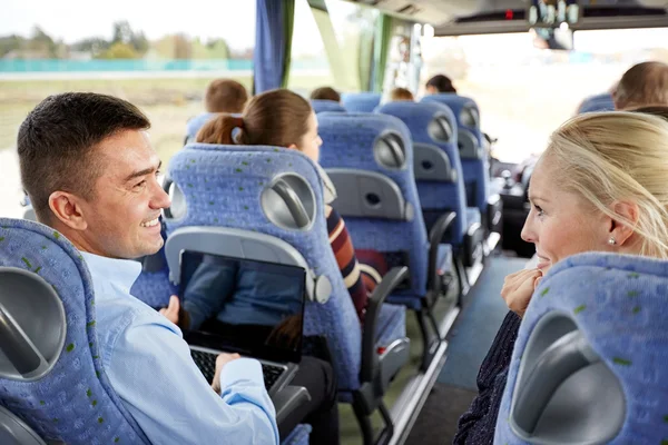 Group of happy passengers in travel bus — Stock Photo, Image