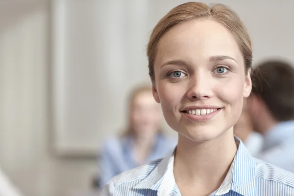 Group of smiling businesspeople meeting in office — Stock Photo, Image