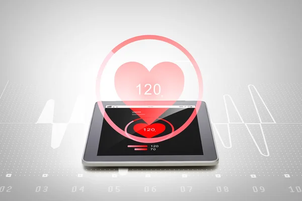 Close up of tablet pc computer with heart rate — Stock Photo, Image