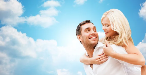 Happy couple over blue sky — Stock Photo, Image