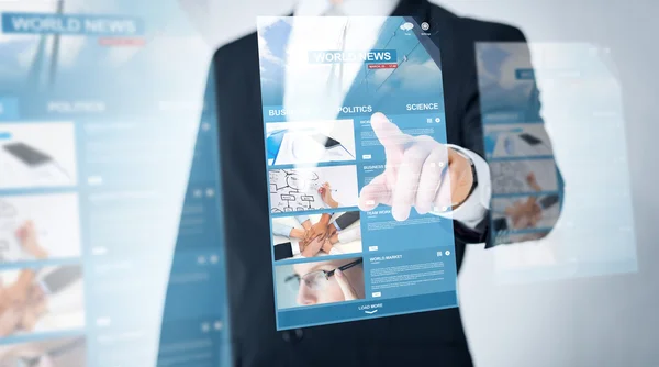 Close up of man pointing finger to world news — Stockfoto