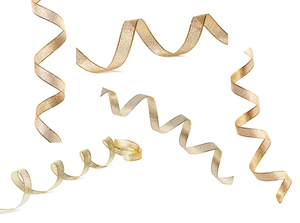 Mooie glitter gouden lint cassette curl geïsoleerd op wit Stockfoto