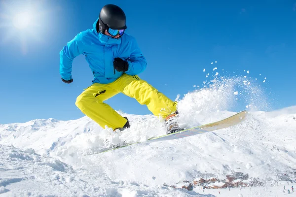 Active snowboarder in mountains — Stock Photo, Image
