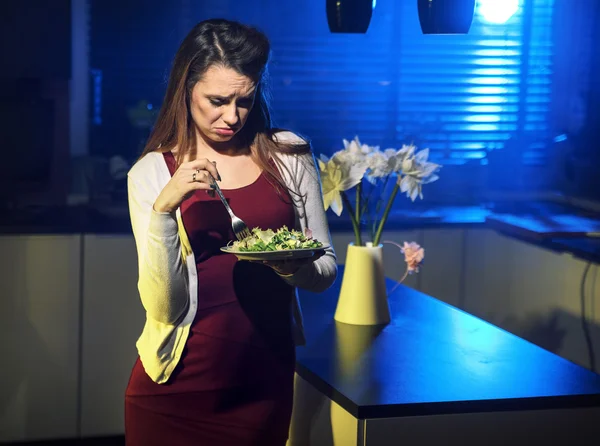 Resigned lady eating a salad — Stock Photo, Image