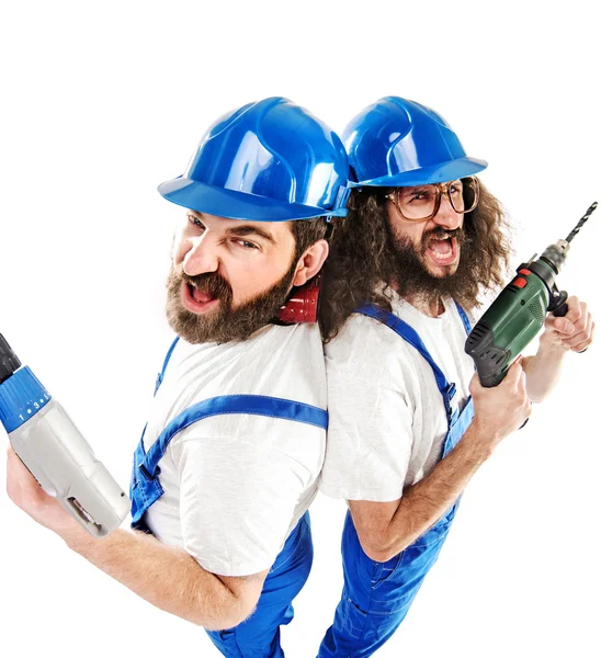 Conceptual picture of two builders while working — Stock Photo, Image