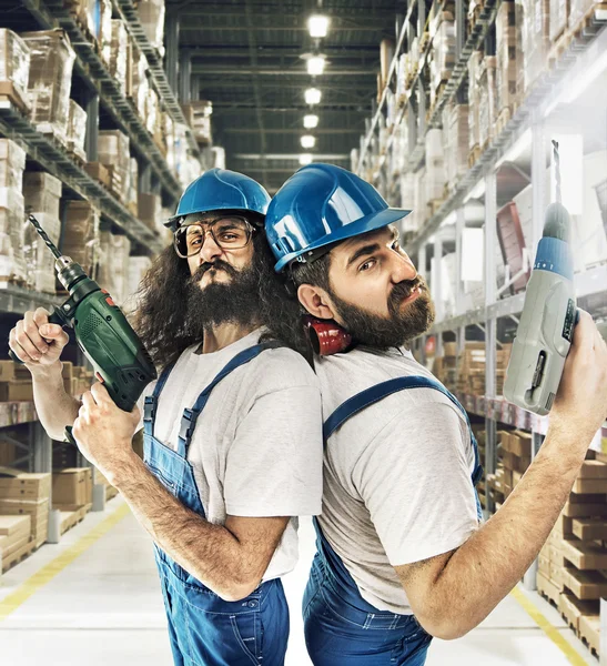 Portrait of two builders in a storehouse — Stock Photo, Image