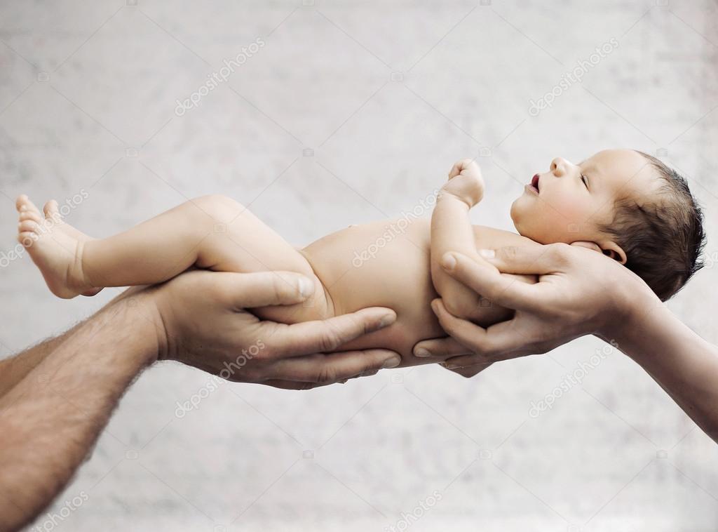 Newborn baby sleeping on parents hand Stock Photo by ©konradbak 101732456