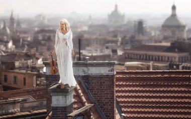 Blonde standing on the chimney with the violin clipart
