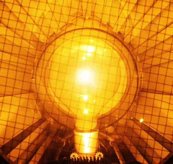 Bright and orange light bulb — Stock Photo, Image