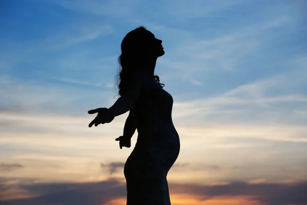 Silhouette of the pregnant woman — Stock Photo, Image