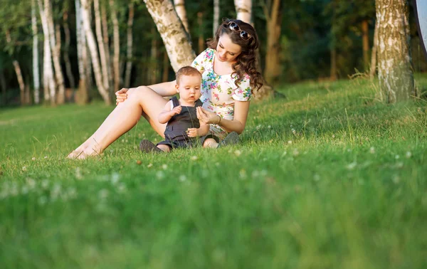 Pregnant mother playing with her child — Stock Photo, Image